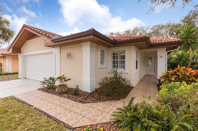 mediterranean / spanish house featuring a garage