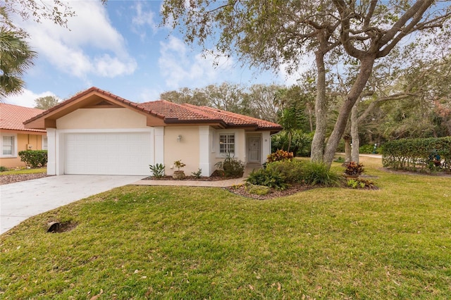 view of front of home with a garage and a front lawn