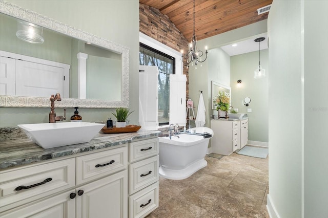 bathroom with vaulted ceiling, a bathing tub, wooden ceiling, and vanity