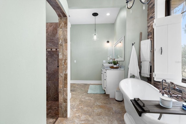 bathroom with vanity and separate shower and tub