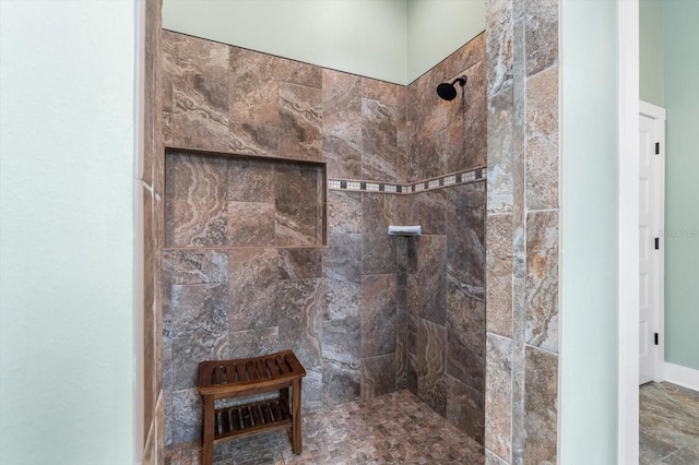 bathroom with a tile shower