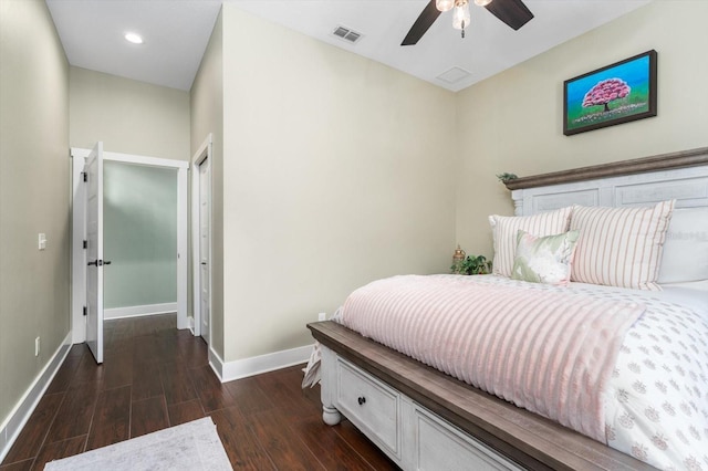 bedroom with ceiling fan and dark hardwood / wood-style floors