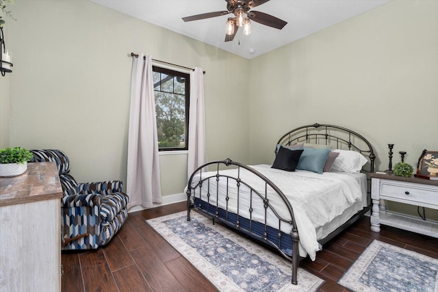 bedroom featuring dark hardwood / wood-style floors and ceiling fan