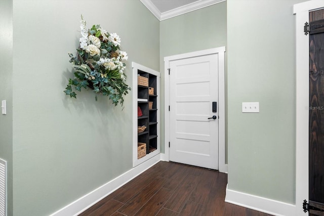 doorway featuring crown molding and dark wood-type flooring