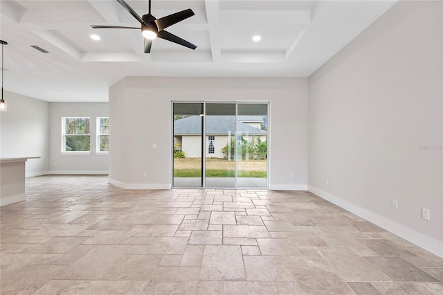 empty room with ceiling fan, coffered ceiling, and beam ceiling