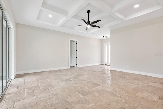 empty room with coffered ceiling, beam ceiling, and ceiling fan