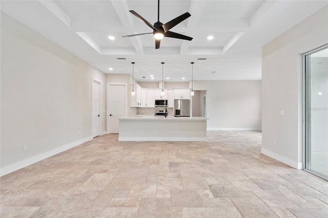 unfurnished living room featuring coffered ceiling, beamed ceiling, and ceiling fan