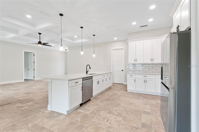 kitchen featuring decorative light fixtures, tasteful backsplash, white cabinetry, stainless steel appliances, and a center island with sink