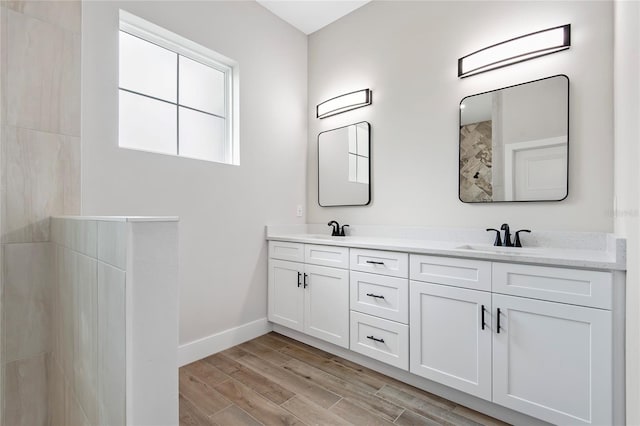 bathroom featuring vanity and wood-type flooring