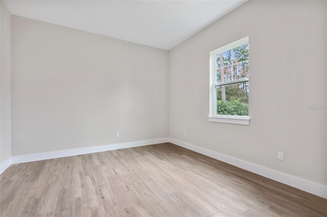 spare room with light hardwood / wood-style floors