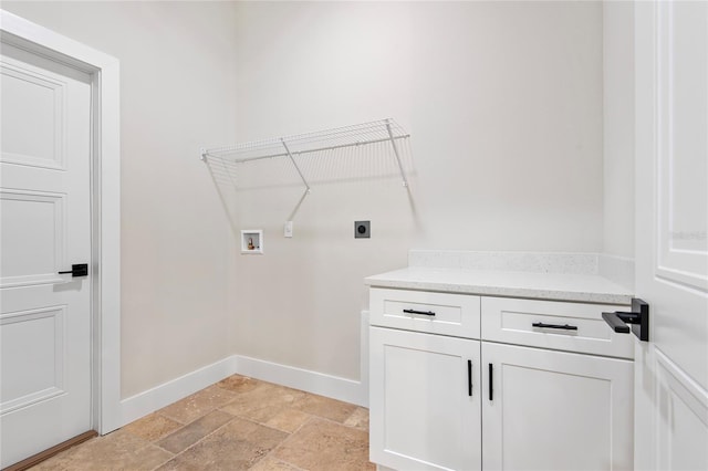 clothes washing area with electric dryer hookup, washer hookup, and cabinets