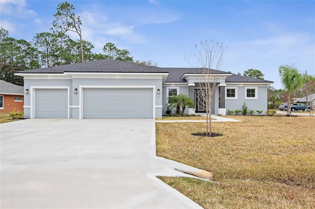 view of front facade featuring a garage and a front yard