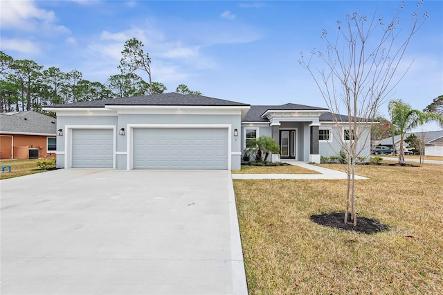 view of front facade featuring a garage, a front yard, and central AC unit