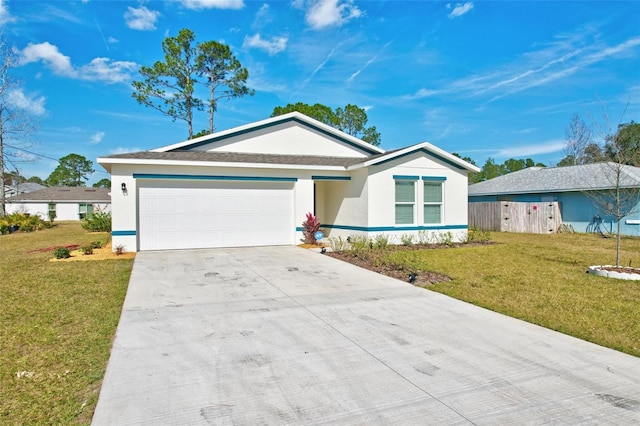 ranch-style home featuring a garage and a front lawn