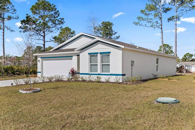 view of front facade with a garage and a front yard