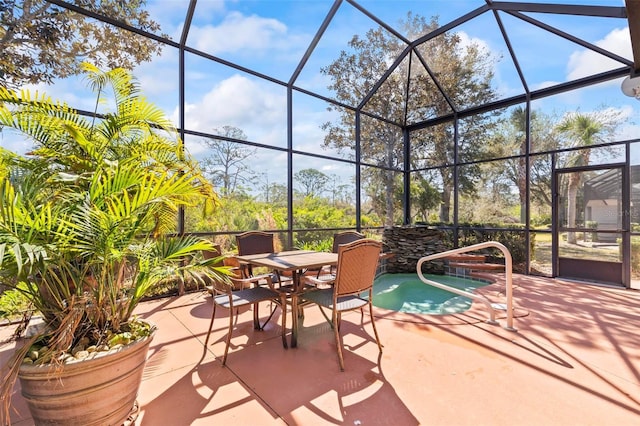 view of patio with a lanai and outdoor dining space