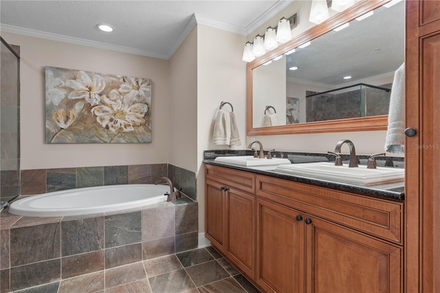 bathroom featuring vanity, crown molding, and shower with separate bathtub