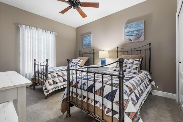 bedroom featuring ceiling fan and carpet