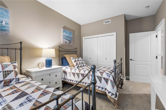 bedroom with light carpet and a closet