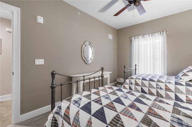 bedroom with ceiling fan and light carpet