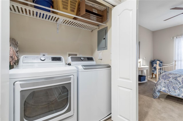 washroom featuring separate washer and dryer, light carpet, and electric panel