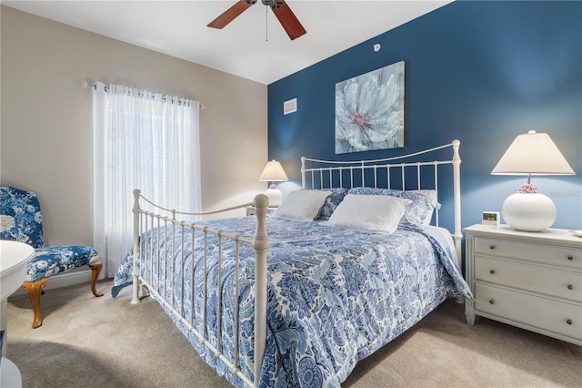 carpeted bedroom with ceiling fan