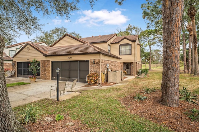 front of property featuring a garage and a front yard