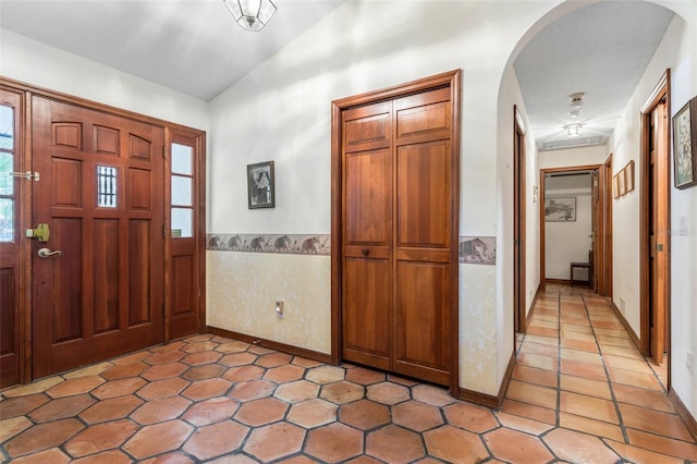 entryway with vaulted ceiling