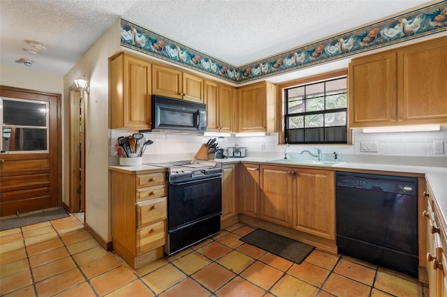 kitchen with light tile patterned floors, sink, tasteful backsplash, black appliances, and a textured ceiling