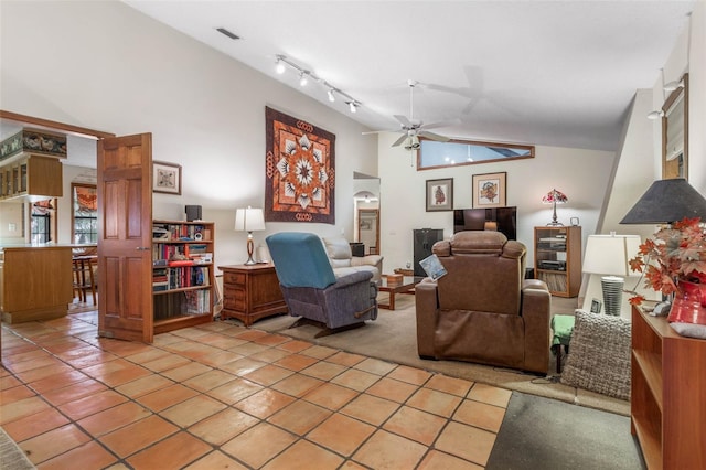 tiled living room featuring track lighting, high vaulted ceiling, and ceiling fan