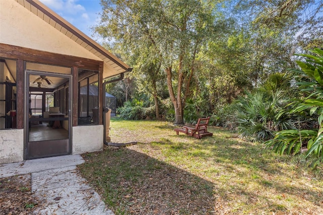 view of yard with a sunroom