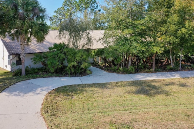 exterior space with a front lawn