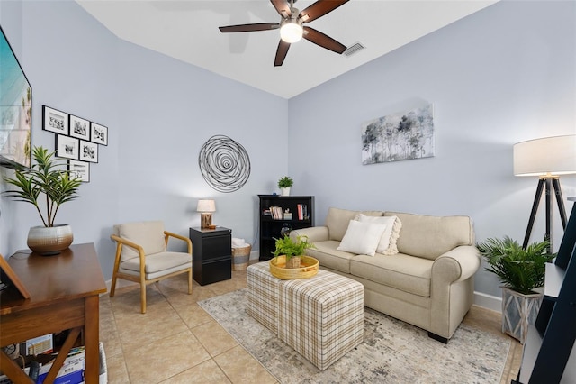 living room featuring ceiling fan and light tile patterned floors