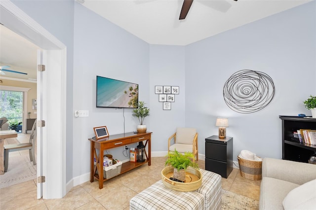 tiled living room with ceiling fan