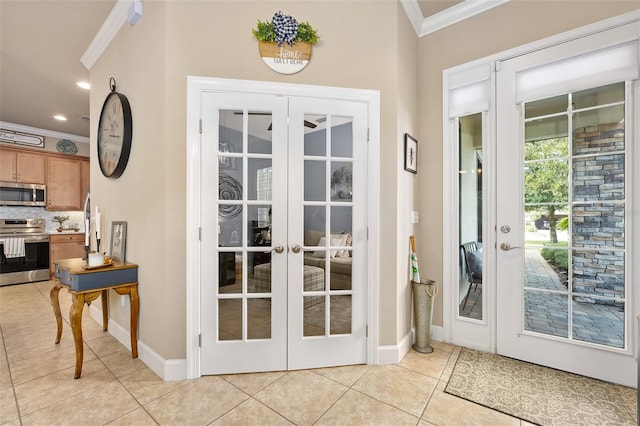 entryway featuring french doors, crown molding, and light tile patterned flooring