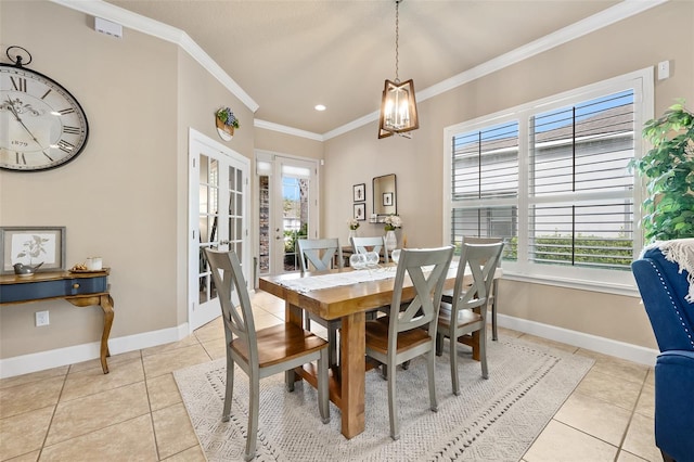 dining space with ornamental molding, french doors, and light tile patterned flooring