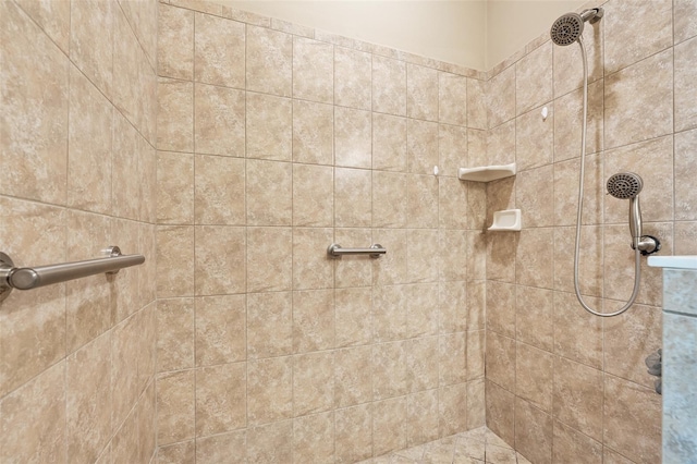 bathroom with a tile shower