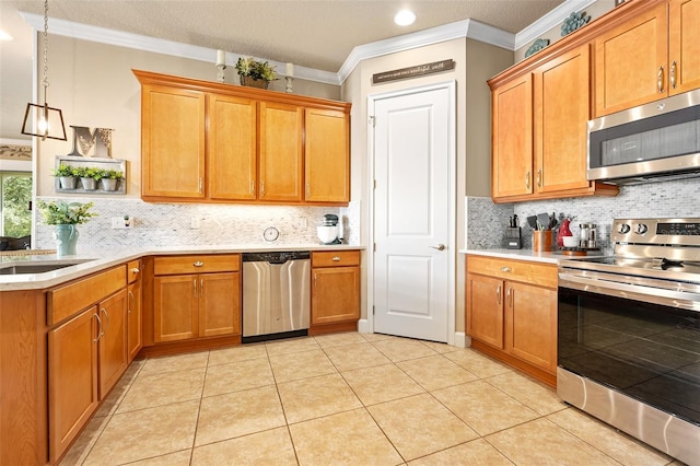 kitchen with pendant lighting, light tile patterned floors, stainless steel appliances, ornamental molding, and decorative backsplash