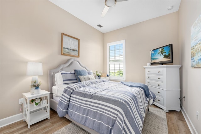 bedroom with ceiling fan and light hardwood / wood-style floors