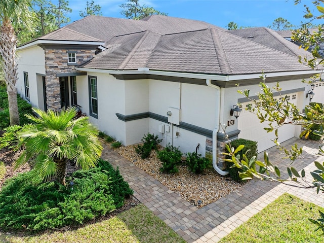 view of side of home featuring a garage