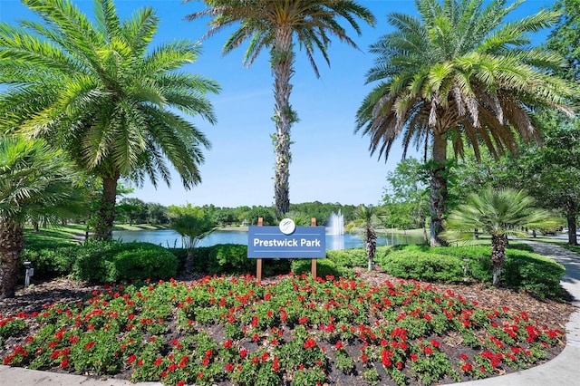 community sign with a water view