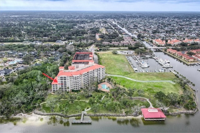 birds eye view of property with a water view