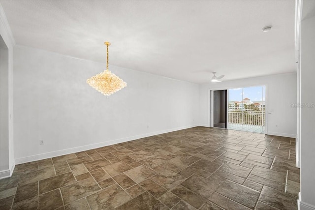 empty room featuring ceiling fan with notable chandelier