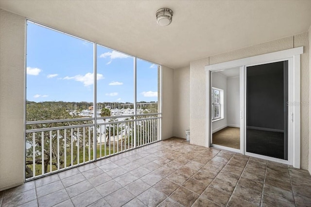 unfurnished sunroom featuring a healthy amount of sunlight