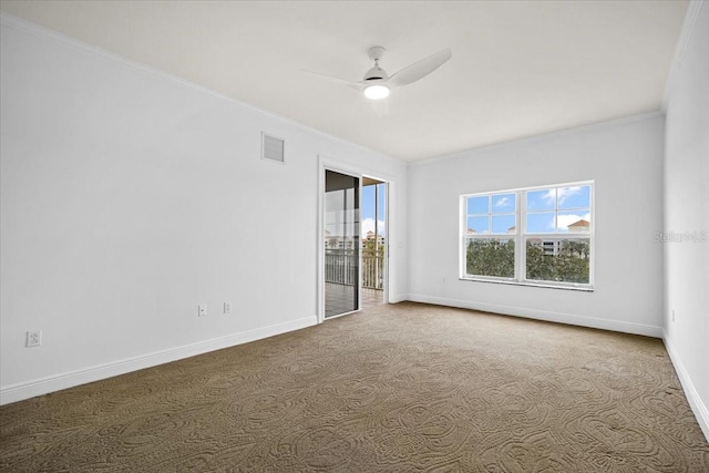 carpeted empty room with ornamental molding and ceiling fan