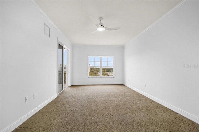 carpeted empty room with ornamental molding and ceiling fan