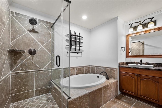 bathroom featuring crown molding, vanity, and shower with separate bathtub