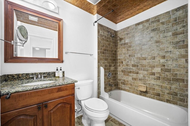 full bathroom with tiled shower / bath combo, vanity, and toilet