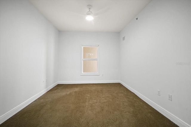 carpeted empty room with ceiling fan