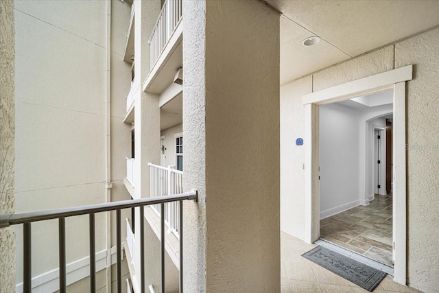 doorway to property featuring a balcony